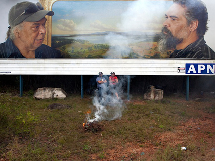 Roy takes a break after showing Kelton the best fishing spots (detail) with Roy Kennedy and Kelton Pell sitting at APN billboard site, Waterfall, NSW; Appropriated Circumstances, 2012