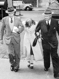 Jean Lee is escorted to the City Watchhouse on November 8, 1949, <BR />by Detectives Ronald Kellett and Cyril Currer