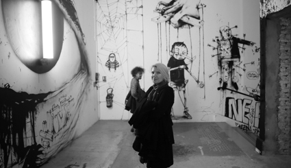 Gail Priest in front of artwork by Dran, part of the exhibition INSIDE, Palais de Tokyo, Paris, 20 Oct, 2014-10 Jan, 2015